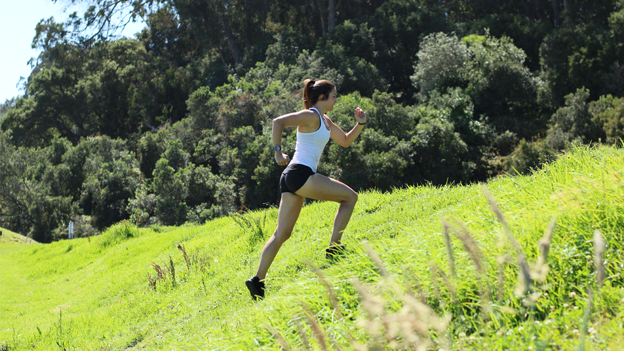 Coach Morgan running hill sprints