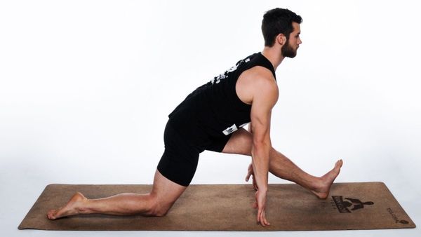 runner doing a half split