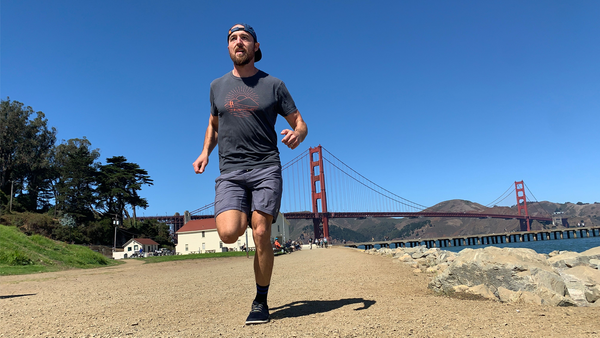 Man running near bridge